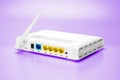 Witeless white router for home network, internet, ethernet connection, close up on magenta background. Royalty Free Stock Photo