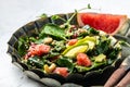 Witer Quinoa salad in bowl with avocado, grapefruit, pomegranate, nuts and microgreens. Quinoa superfood concept. Clean healthy