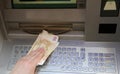 Withdraws money euro banknotes from an ATM of a European bank Royalty Free Stock Photo