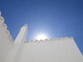 White chimney roof and sun in Binibeca, Menorca, Spain