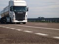 White Scania truck on highway