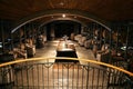 Wither Hills vineyard cellar in New Zealand, with several wooden barrels dotted around the room