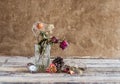 Withered rose in glass and watch on wooden background Royalty Free Stock Photo