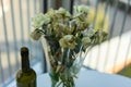 Withered yellow roses and wine bottle Royalty Free Stock Photo