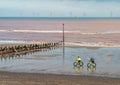 Two Cyclists on the beach