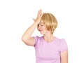 Witless young woman holding her hand to her forehead Royalty Free Stock Photo