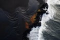 Witness the awe-inspiring sight of molten lava flowing into the ocean from above, The black sand beach in Iceland, Aerial view of Royalty Free Stock Photo