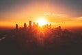 Witness the breathtaking beauty of a cityscape as the sun gracefully descends below the horizon, A city skyline silhouetted Royalty Free Stock Photo