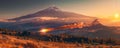 Astounding Sunset Landscape with Majestic Mountain and Fiery Meteor Streaking Across the Sky Captured in Stunning Digital Artwork Royalty Free Stock Photo
