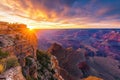 Witness the breathtaking sight of the sun sinking below the horizon over the majestic Grand Canyon, A breathtaking view of the