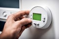 Hand adjusting indoor thermostat household technology Royalty Free Stock Photo