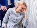 Witness of crime in office. Female with disgusting face. Businessman Sexually Harassing Female Colleague. Royalty Free Stock Photo