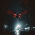 Nocturnal Visitor: Mothman Soars Above Urban Street in Night Sky Royalty Free Stock Photo