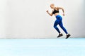 Witness the quickness. Full length shot of an attractive young female athlete running along the track.