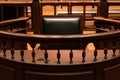 A witness stand with a black seat in the court room infront of tribunal when witness testify of evidence to judge, they will sit a Royalty Free Stock Photo