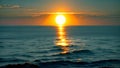 Witness the stunning sight of the sun sinking below the horizon as the day comes to a peaceful end over the vast ocean, A bright