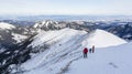 Winter mountain tourism. Tourists coming to the top