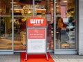Witt Weiden with signage banner please wear your masks inside the store due to