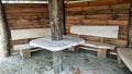 Witterungsschutz mit BÃÂ¤nke unWeather protection with benches and a wooden table, mobile photod einem Tisch aus Holz, mobile Foto