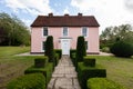 Pink detached Suffolk farmhouse