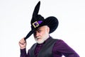 Wizard costume hat Halloween party. Senior man white beard celebrate Halloween. Magician witcher old man. Magic concept