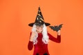 Wizard or magician. Halloween party. Photo booth props. Small girl in black witch hat. Autumn holiday. Join celebration Royalty Free Stock Photo