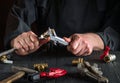Wizard or master measures the size of fitting using a caliper before connecting water or gas pipe. Close-up of the hands of the