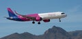 Wizz Air Airlines flies in the blue sky. Landing at Tenerife Airport Royalty Free Stock Photo