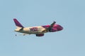 Wizz air plane on the blue sky Royalty Free Stock Photo