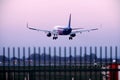 Wizz Air plane in the sky, landing on runway Royalty Free Stock Photo