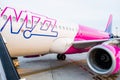 The Wizzair aircraft is prepared for passenger boarding.