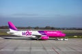 Wizzair aircraft towed by the service truck