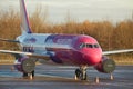 Wizzair airliner parked with engine covers