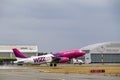 A Wizzair airliner takes off from the runway. Departure of the plane from the airport. Riga International Airport, Marupe, Latvia