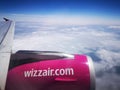 Wizzair plane wing and engine during flight Royalty Free Stock Photo