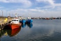 Wladyslawowo, Pomorskie Poland - February, 24, 2021: Fishing boats moored in the port. Port infrastructure in a small town in