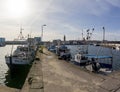 Wladyslawowo, Pomorskie Poland - February, 24, 2021: Fishing boats moored in the port. Port infrastructure in a small town in