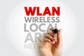 WLAN Wireless Local Area Network text concept with hand writing marker, symbolizing connectivity, wifi, devices, and communication Royalty Free Stock Photo