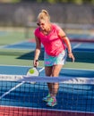 Woman warming up for game of pickleball