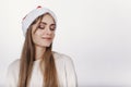 Woamn in santa hat dreams about holidays Royalty Free Stock Photo