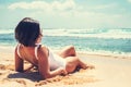 Woamn takes a sun bath on tropical beach Royalty Free Stock Photo