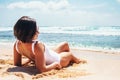 Woamn takes a sun bath on tropical beach Royalty Free Stock Photo