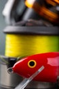 Wobbler, reel, fishing line in bright color Royalty Free Stock Photo