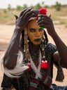 Wodaabe man checking makeup in a mirror, Gerewol, Niger Royalty Free Stock Photo