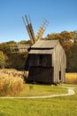 Wodden windmill forest background blue sky