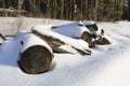 Woden logs under snow Royalty Free Stock Photo