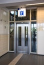 Doors to lift elevator with sign above