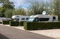 Motorhome campers parked on hardstanding in a camping camp site