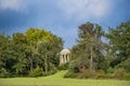 Woerlitzer Park Venus Temple behind trees and cloudscape Royalty Free Stock Photo