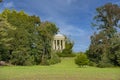Woerlitzer Park Venus Temple behind trees and cloudscape Royalty Free Stock Photo